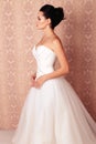 Beautiful tender bride in elegant wedding dress