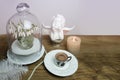 Beautiful tender stilllife, snowdrop, Galanthus in vase, candle, small cup of coffee, cappuccino, concept of coffeetime, romantic