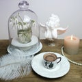 Beautiful tender stilllife, snowdrop, Galanthus in vase, small cup of coffee, cappuccino, concept of coffeetime, romantic spring