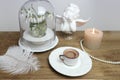 Beautiful tender stilllife, snowdrop, Galanthus in vase, small cup of coffee, cappuccino, concept of coffeetime, romantic spring