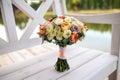 Beautiful tender wedding bouquet of roses with cotton