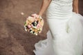 Beautiful tender wedding bouquet of roses and eustoma flowers in hands Royalty Free Stock Photo