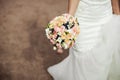 Beautiful tender wedding bouquet of roses and eustoma flowers in hands Royalty Free Stock Photo