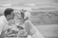 Wedding couple drinking wine on beach Royalty Free Stock Photo