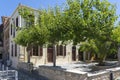 A beautiful terrace with trees and palms on Riga Fereou street in the old town of Rethymno, Crete, Greece Royalty Free Stock Photo