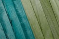 Beautiful texture of natural wood slats of light and dark green color turquoise.