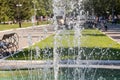 Beautiful texture of water drops of the fountain in the sunny day in the park in summer Royalty Free Stock Photo