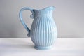 Beautiful textured blue jug for drinks close-up. Royalty Free Stock Photo