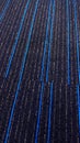 Beautiful textured carpet with blue lines.