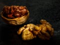 Beautiful textured Half split walnut in shell and walnut kernel on black background Royalty Free Stock Photo