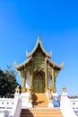 Beautiful Thai chapel temple on bright blue sky background and vast space Royalty Free Stock Photo