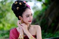 Beautiful Thai girl in traditional dress costume as Thai temple Royalty Free Stock Photo