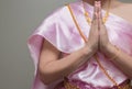 Beautiful Thai girl in traditional dress costume,press the hands together at the chest Royalty Free Stock Photo