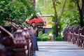 Beautiful Thai girl in traditional dress costume red umbrella as Royalty Free Stock Photo