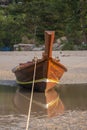 Beautiful thai long tail boat moored on the sand of a phuket
