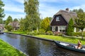 Beautiful thatched buildings in the famous village of Giethoorn in the Netherlands with water canals.