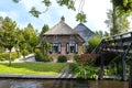 Beautiful thatched buildings in the famous village of Giethoorn in the Netherlands with water canals.