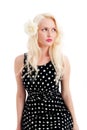 Beautiful thoughtful female in polker dot dress