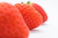 beautiful three fresh red strawberry isolated on white background Royalty Free Stock Photo