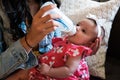 Beautiful Baby Girl Feeding Royalty Free Stock Photo