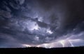 Beautiful thunderstorm with clouds and lightning over the night city Royalty Free Stock Photo