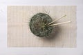Beautiful tillandsia plants in bowl as Asian noodles on white wooden table, top view. House decor Royalty Free Stock Photo