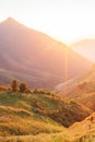 Beautiful time. Bright and colorful scenic landscape. Golden sunlight shines down around the mountains and paddy fields. Fantastic Royalty Free Stock Photo