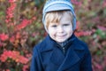 Beautiful toddler boy in blue coat on winter day Royalty Free Stock Photo
