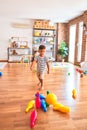 Beautiful toddler boy playing bowling at kindergarten Royalty Free Stock Photo