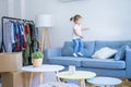 Beautiful toddler child girl jumping on the sofa Royalty Free Stock Photo