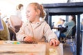 Beautiful toddler child girl sitting on baby highchair crying and screaming