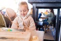 Beautiful toddler child girl sitting on baby highchair laughing