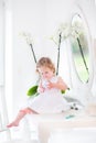 Beautiful toddler girl playing with cosmetics Royalty Free Stock Photo