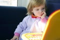 Beautiful toddler little girl with toy computer