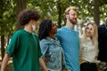 Beautiful tolerant mixed race people gathered together to show that friendship has no race