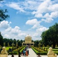 A beautiful tomb with dull blue sky and clouds