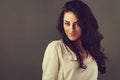 Beautiful toothy enjoying flirting woman with long brown healthy curly hair style in white shirt clothing. Closeup toned vintage Royalty Free Stock Photo