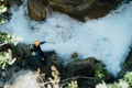 Beautiful top angle shot people doing extreme sports over a river ina stony mountain
