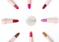 Beautiful top view makeup puff and various colors lipsticks