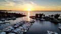 Beautiful top view to  Royal Harbour Court  with white yachts moored by the pierce at golden sunset Royalty Free Stock Photo