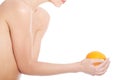 Beautiful topless woman holding an orange. Royalty Free Stock Photo