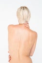 Beautiful topless woman touching her back Royalty Free Stock Photo