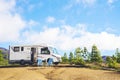 Beautiful tourism camper van campsite in the nature. Travel and rv renting vehicle vacation. Vanlife and wanderlust concept with Royalty Free Stock Photo