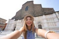 Beautiful tourist girl takes selfie photo in Bologna, Italy Royalty Free Stock Photo