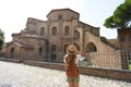 Beautiful tourist girl visiting the Basilica of San Vitale in Ravenna, Italy Royalty Free Stock Photo
