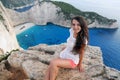 Beautiful tourist at Navagio beach, Zakynthos Island, Greece