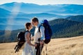 Beautiful tourist wedding couple hugs on the top of mountain. Honeymoon in Alps Royalty Free Stock Photo