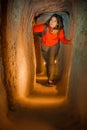 Young tourist woman explore ancient Derinkuyu underground cave city