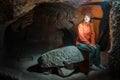 Young tourist woman explore ancient Derinkuyu underground cave city