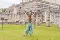 Beautiful tourist woman observing the old pyramid and temple of the castle of the Mayan architecture known as Chichen Royalty Free Stock Photo